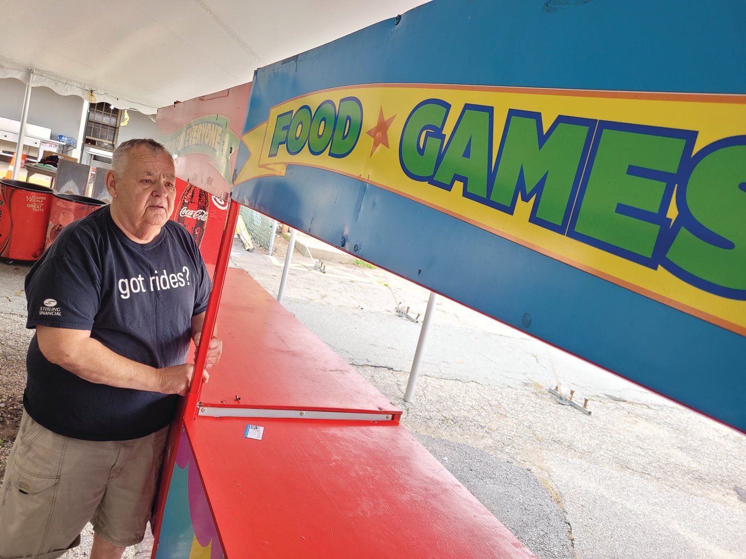 GOT RIDES? Dave Charron, father of David Charron of Rockwell Amusements, helped set up booths under the big top behind St. Rocco’s Church in Johnston on Monday.